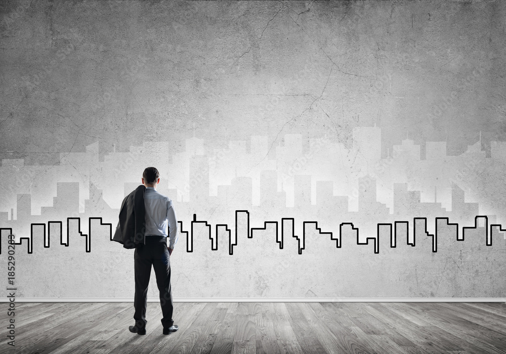 Silhouette of modern cityscape drawn on wall in room Silhouette of modern cityscape drawn on wall in room
