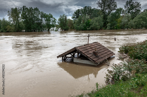 Flood water overflow the house. Weather or Hurricane disaster concept.