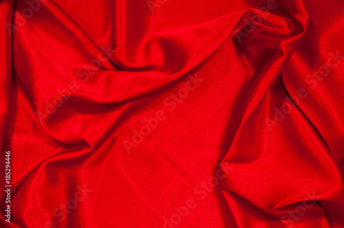 Smooth elegant red silk or satin luxury cloth texture can use as abstract background. Luxurious valentines day background design