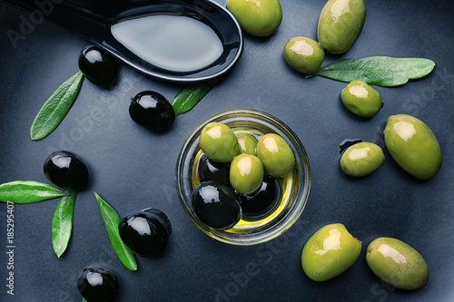 Bowl with olive oil on plate