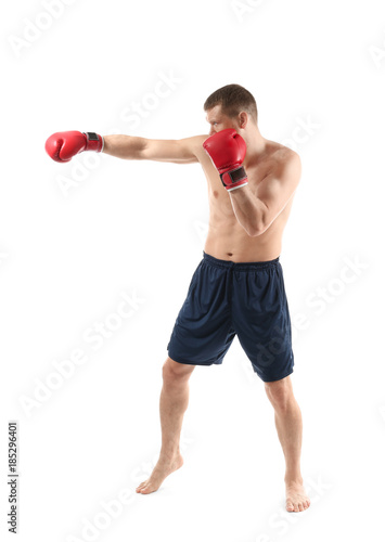 Attractive young boxer on white background © Africa Studio
