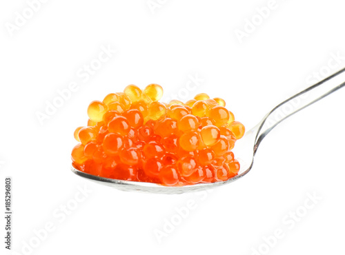 Delicious red caviar in spoon on white background