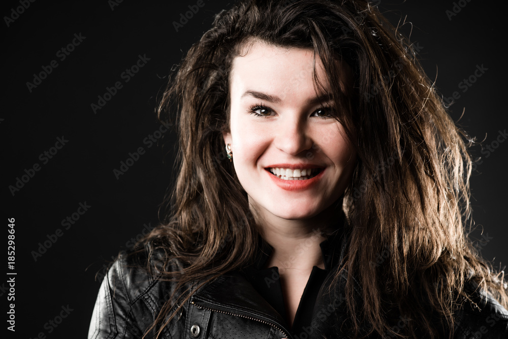 Woman rock style portrait over dark background Woman rock style portrait over dark background
