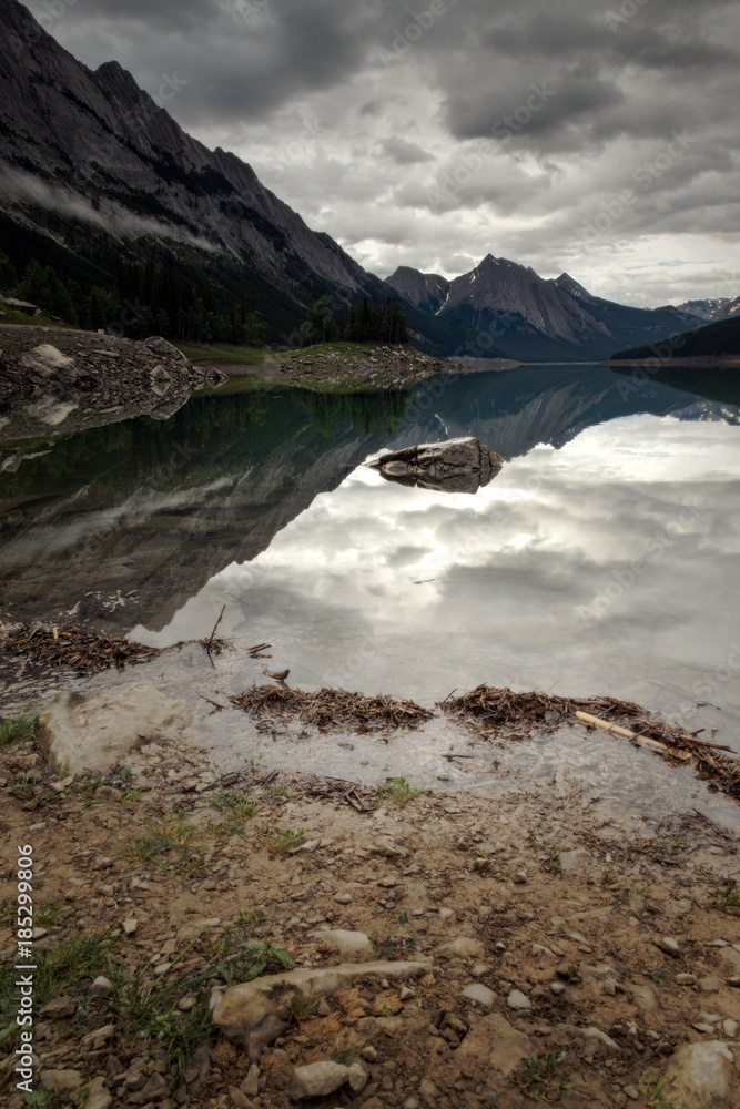 Jasper Alberta Landscape with a stormy sky, lake and mountain and reflections