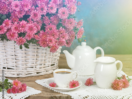 The concept of breakfast. Flowers and tea on the table. Retro Hipster Version