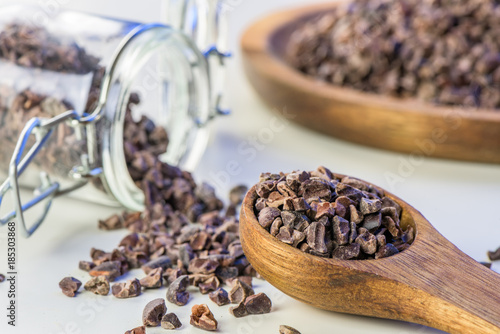 Cocoa beans and cacao powder - closeup with detail macro shot photo