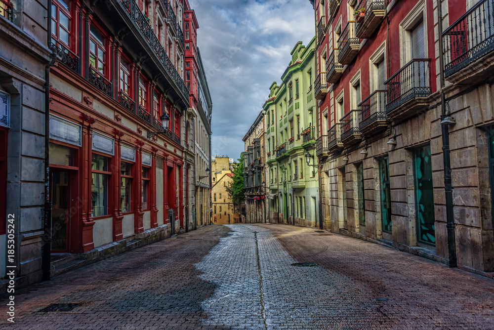 Empty street with colorful old buildings during early morning un