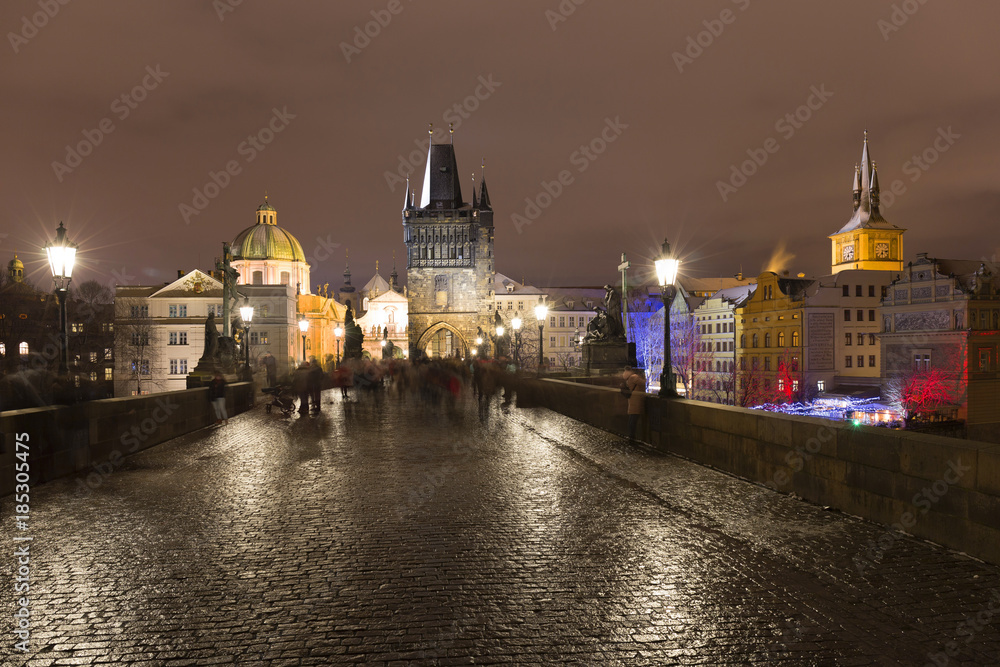Night snowy Prague Old Town from Charles Bridge, Czech republic