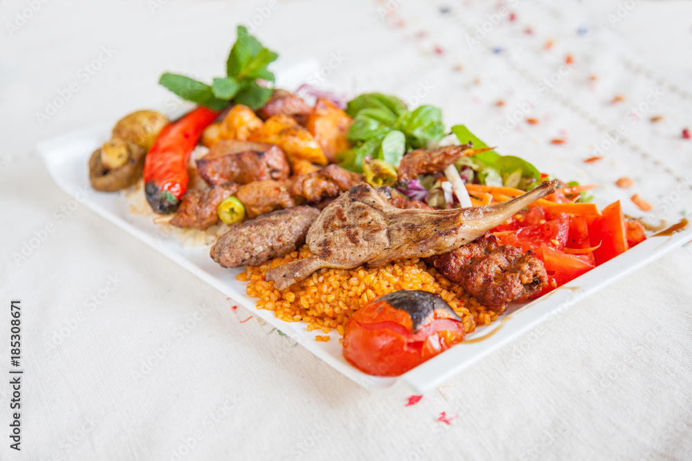 Mixed grill plate with rice and vegetables Mixed grill plate with rice and vegetables