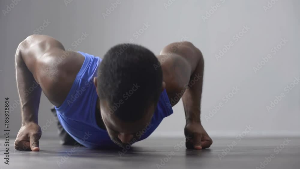 Sportsman doing push-ups before competition, training sessions, health care Sportsman doing push-ups before competition, training sessions, health care