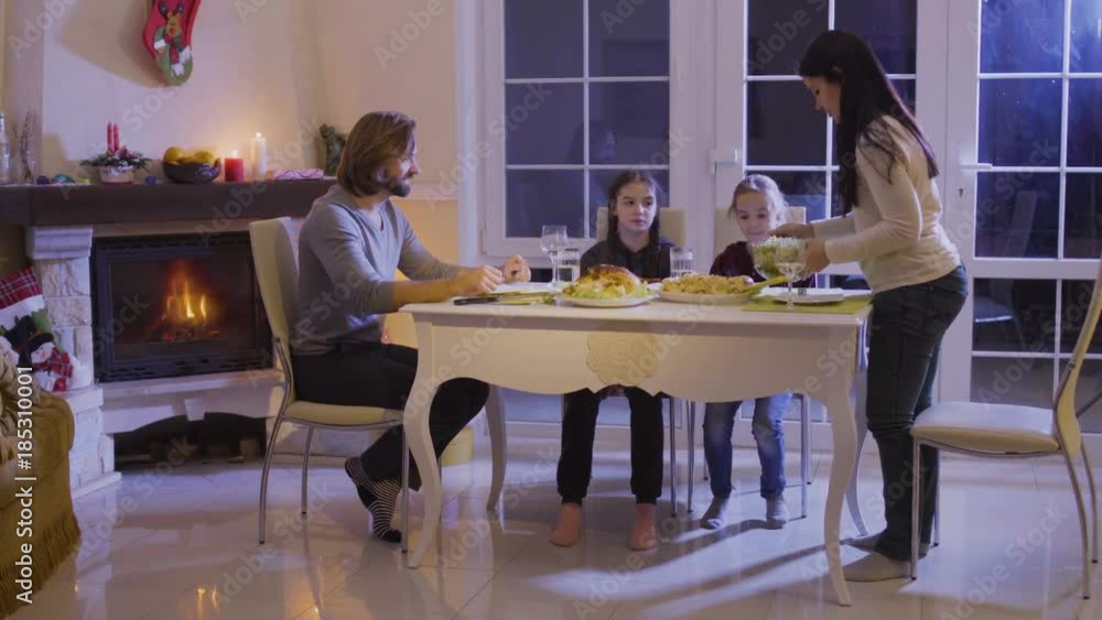 Happy family has a festive dinner at the christmas table Happy family has a festive dinner at the christmas table