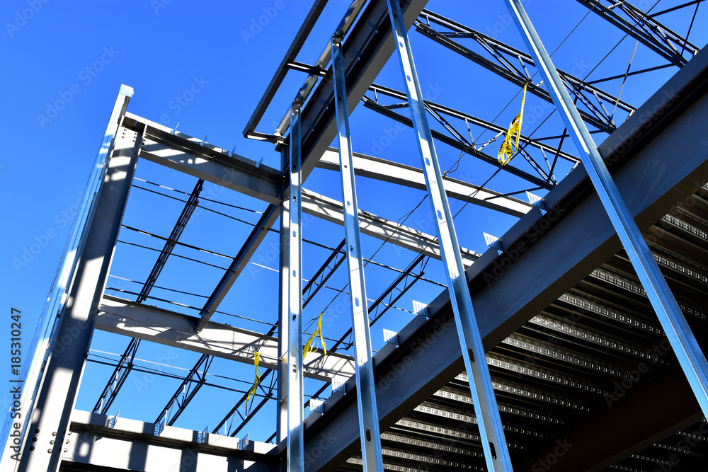 Steel framework of new commercial building under construction. Steel framework of new commercial building under construction.