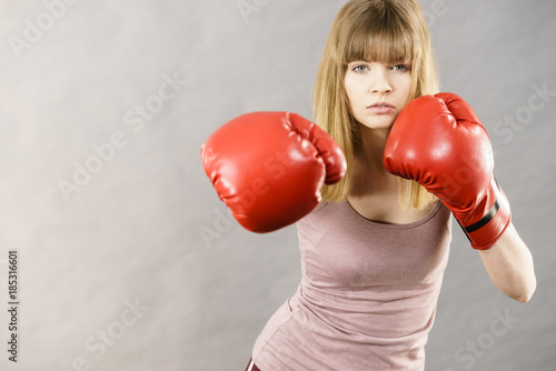 Woman wearing boxing gloves