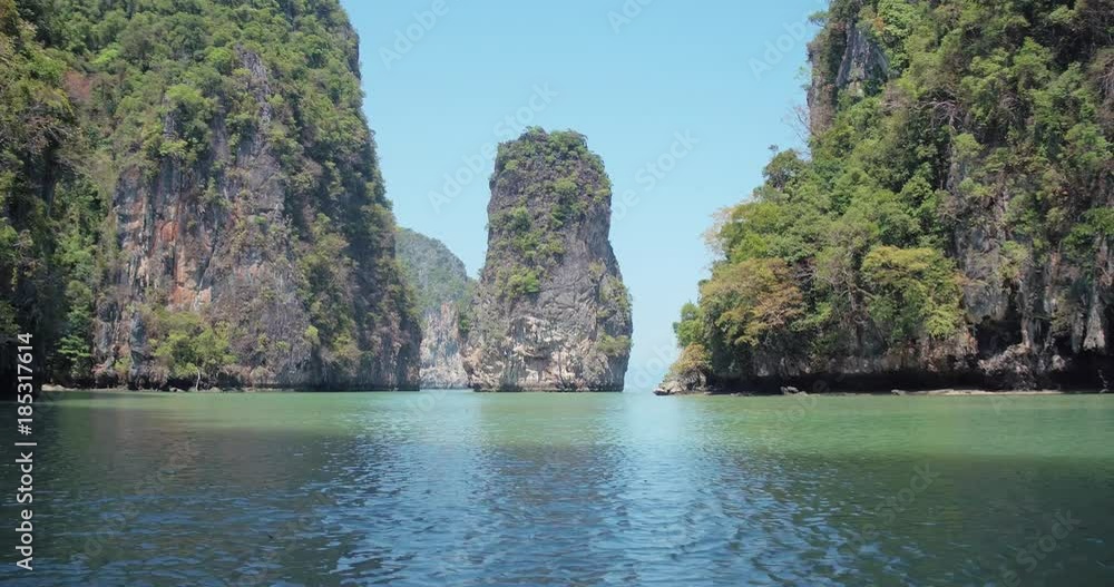 PHUKET, THAILAND, MARCH 2017: Padling in small boats, through caves and alleys in Phi Phi Islands PHUKET, THAILAND, MARCH 2017: Padling in small boats, through caves and alleys in Phi Phi Islands