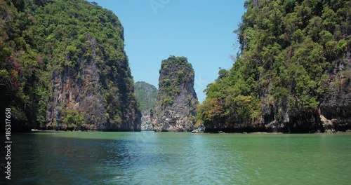 PHUKET, THAILAND, MARCH 2017:  Padling in small boats, through caves and alleys in Phi Phi Islands photo