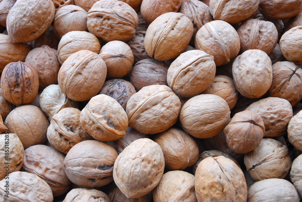 walnut in pile during harvest season as food background walnut in pile during harvest season as food background