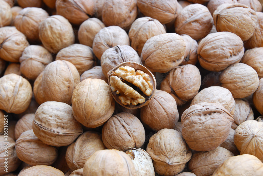 walnut in pile during harvest season as food background walnut in pile during harvest season as food background
