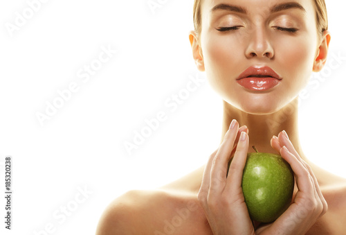 Young happy woman with green apple - isolated on white