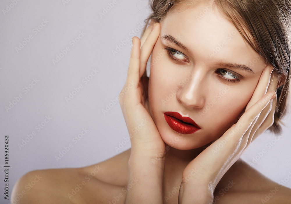 Beauty face of young woman, red lips make-up, clean skin. Beauty face of young woman, red lips make-up, clean skin.