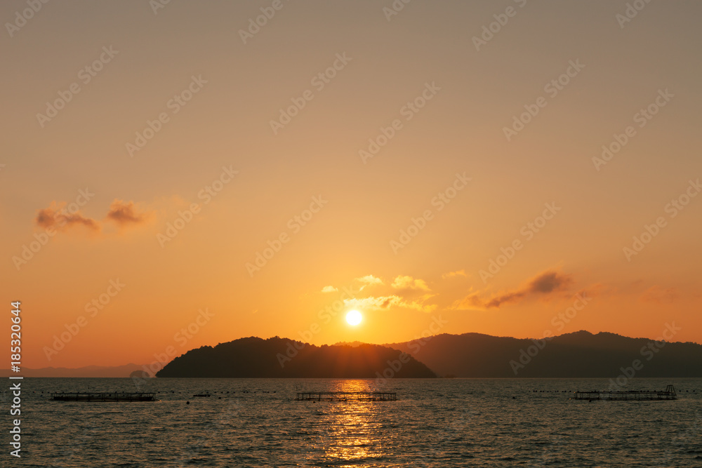 Beautiful sunrise or sunset over tropical sea in phuket thailand.