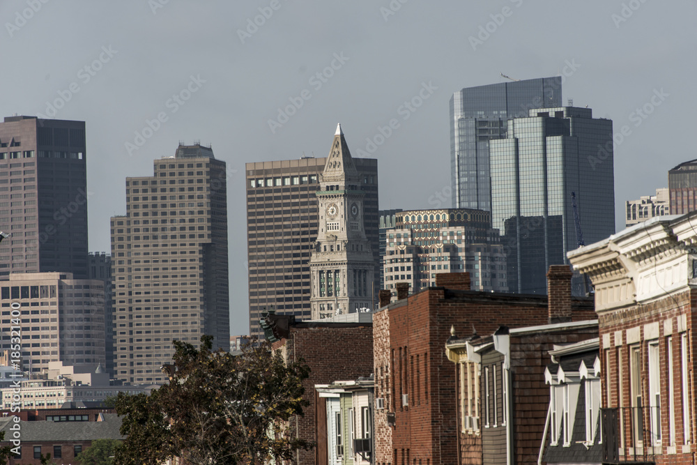 Boston city apartment buildings in front of skyline in Massachusetts USA Boston city apartment buildings in front of skyline in Massachusetts USA