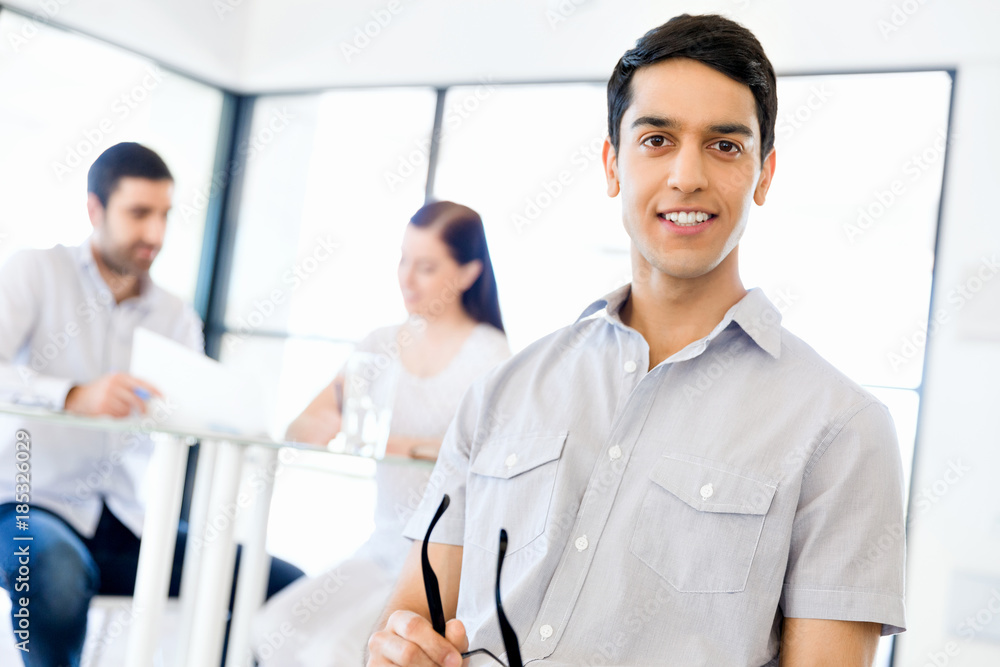Young man in casual in office Young man in casual in office