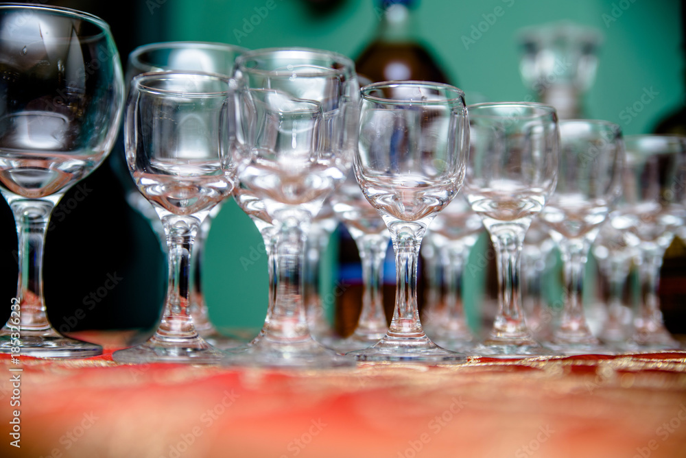 Glass glasses stand on a buffet table Glass glasses stand on a buffet table