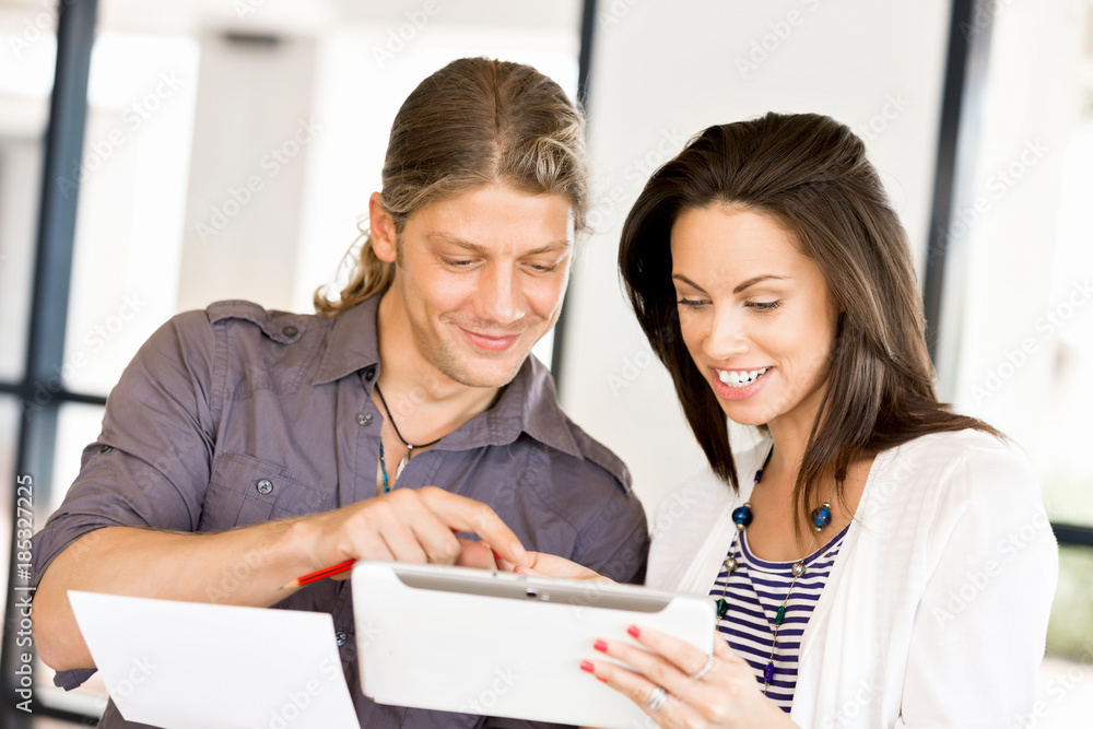 Image of two young business people in office Image of two young business people in office