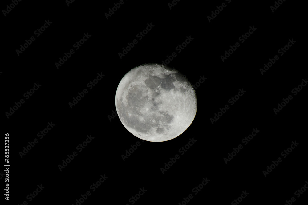 Full moon over dark black sky Full moon over dark black sky