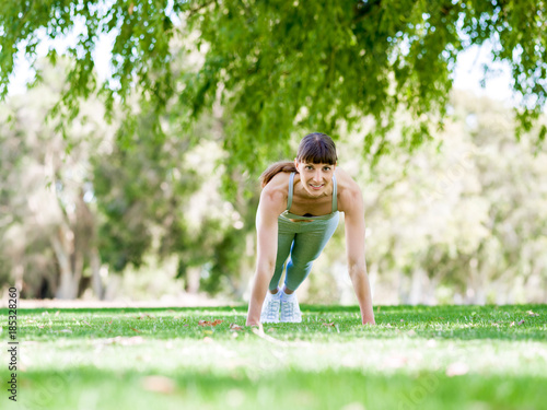 Young woman exercising in the park