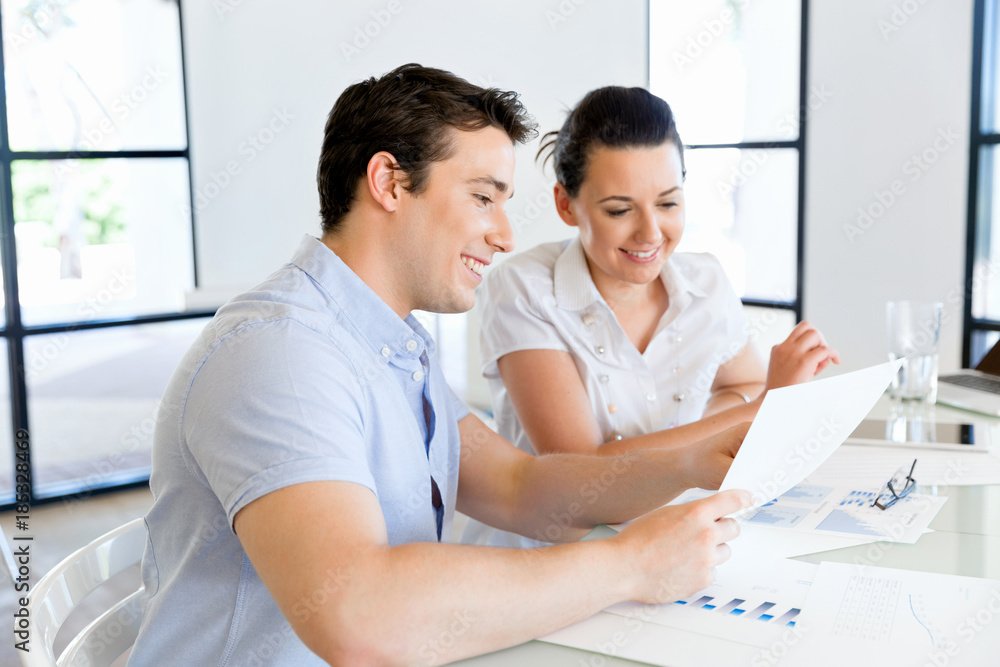 Image of two young business people in office Image of two young business people in office