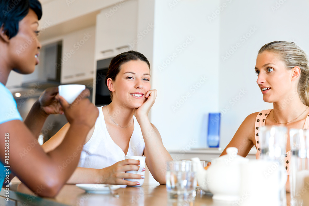 Happy friends talking and drinking coffee and tea Happy friends talking and drinking coffee and tea
