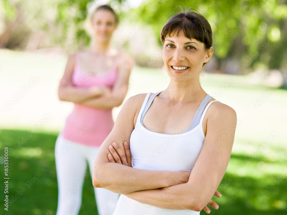 Fototapeta premium Young women exercising in the park