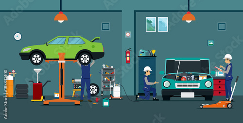 Employees are checking and repairing cars in the garage.

