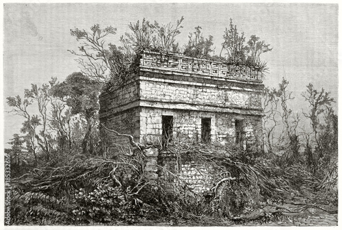 Ancient stone temple quite hidden by south american vegetation. Chichen-Chob or Red House Mayan edifice in Chichen-Itza Yucatan Mexico. By Guaiaud published on Le Tour du Monde Paris 1862 photo