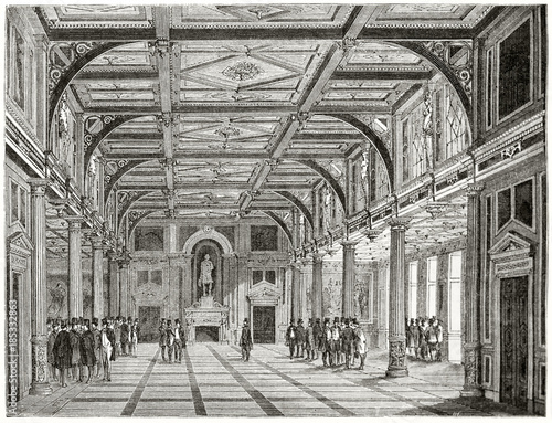 Photography Frontal perspective view of an ancient big luxury room with high coffered ceiling and columns