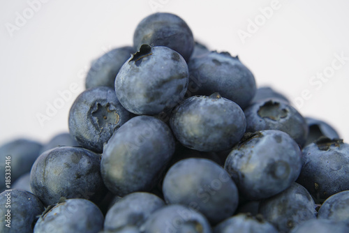 Fresh blueberries on white background close up