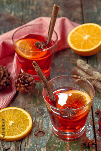 Christmas mulled wine on a rustic wooden table. Holidays concept.