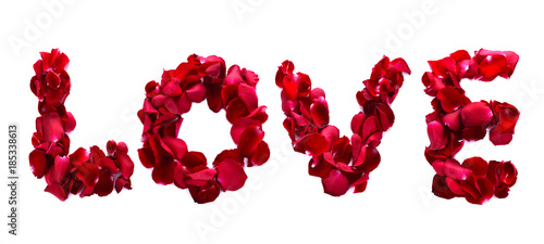 The word love is written with rose petals on a white background.