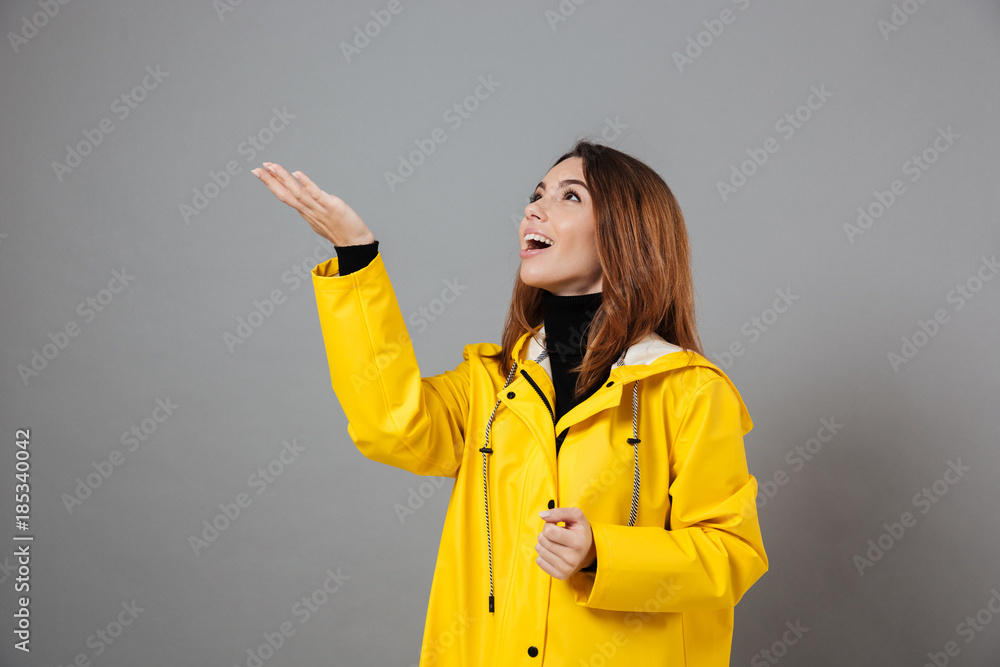 Portrait of an excited girl dressed in raincoat Portrait of an excited girl dressed in raincoat