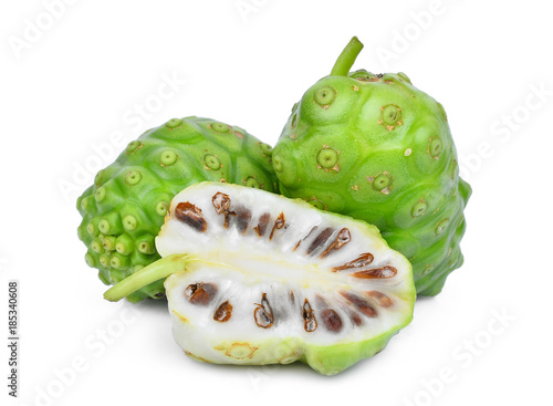 whole and half of noni fruit isolated on white background