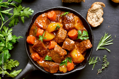 Beef stew, goulash in cast iron pan