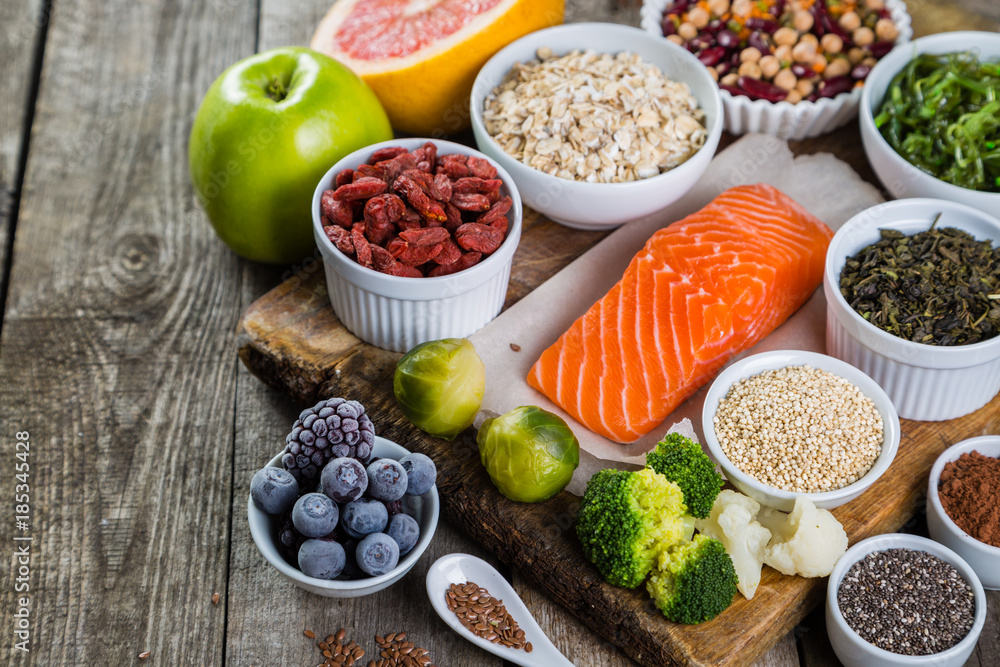 Selection of superfoods on rustic background Selection of superfoods on rustic background