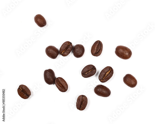 Coffee beans pile isolated on white background and texture, top view 