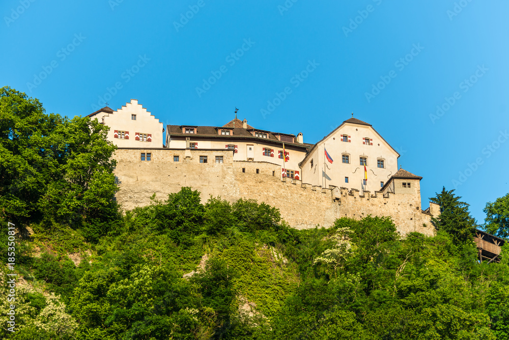 The Vaduz Castle in Liechtenstein. Principality of Liechtenstein is one of the world's smallest countries. It is located between Switzerland and Austria.