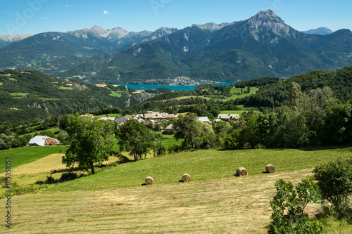 Top view on French Serre-Poncon lake and surroinding Alps mountains during the summer season. photo