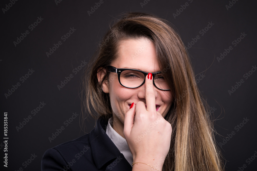 Business woman with glasses doing obscene sign Business woman with glasses doing obscene sign