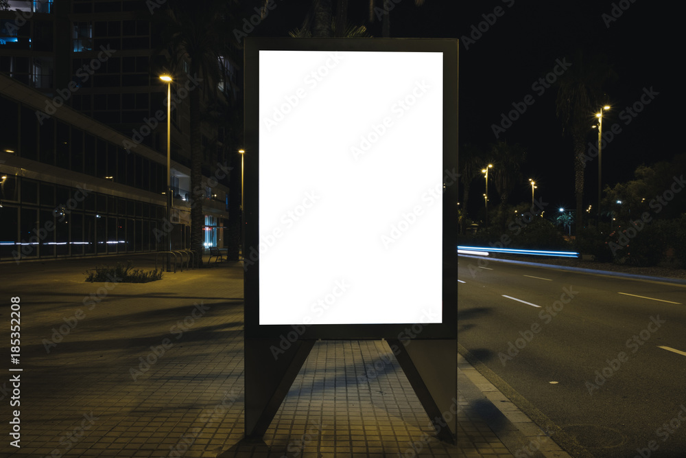 Blank white advertisement lightbox by the road at night. Mock-up design concept. Blank white advertisement lightbox by the road at night. Mock-up design concept.