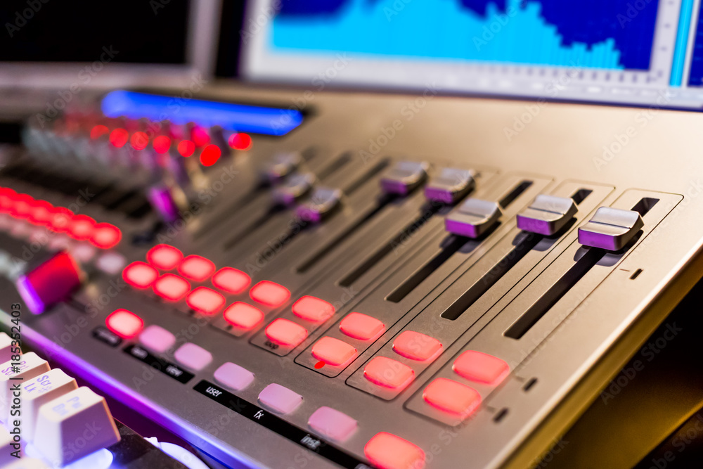 Fototapeta premium digital audio mixer in recording, editing, broadcasting studio. shallow dept of field. music background