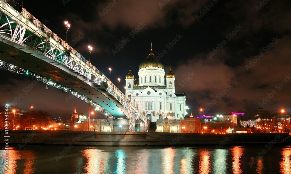 View of Temple of Christ Savior at night. Moscow, Russia/He stands on banks of  Moscow river, it leads to bridge. Taken late evening, before Christmas, festive illumination of city